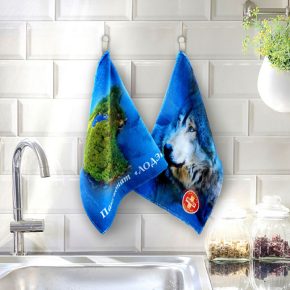 modern sink on black kitchen counter with vase of plant
